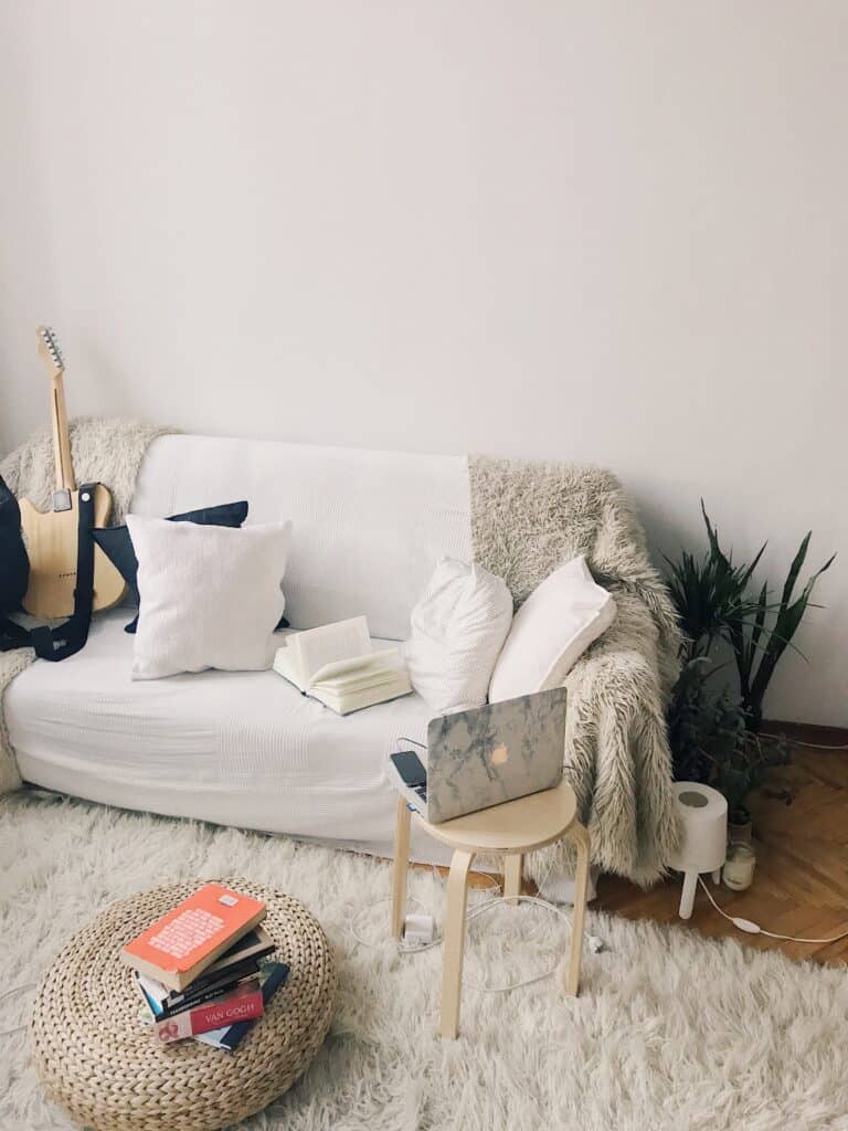 Sofa with a faux sheepskin rug