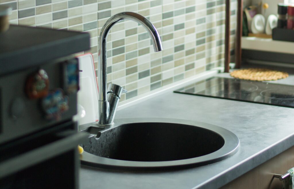 A gray kitchen sink