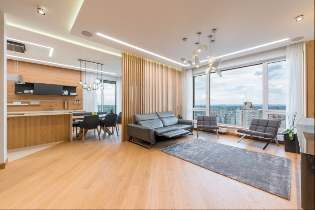 A living room near the window with an area rug