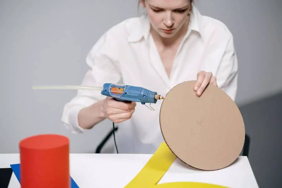 Woman using a glue gun for her crafts