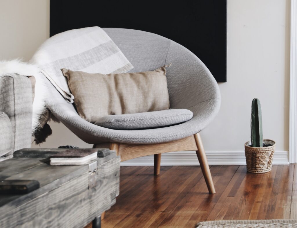 A papasan chair with few cushions in place