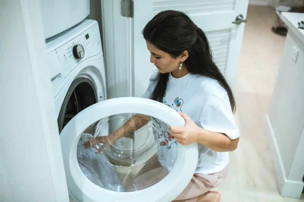 A person checking the laundry