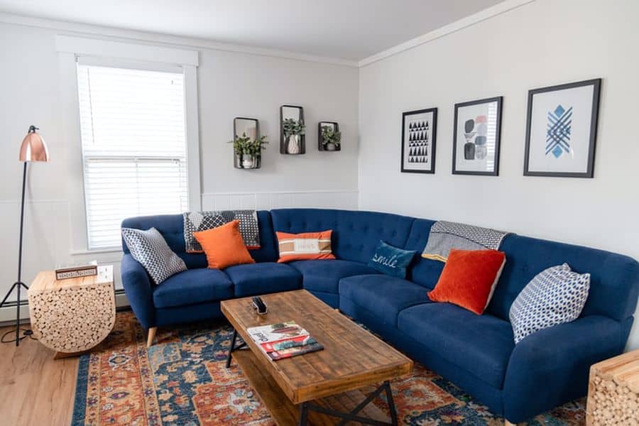 Blue couch with polypropylene rug