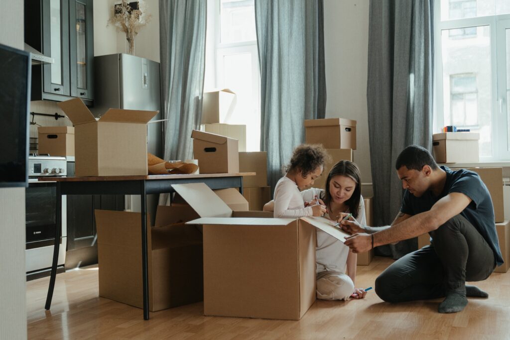 Family labeling moving boxes