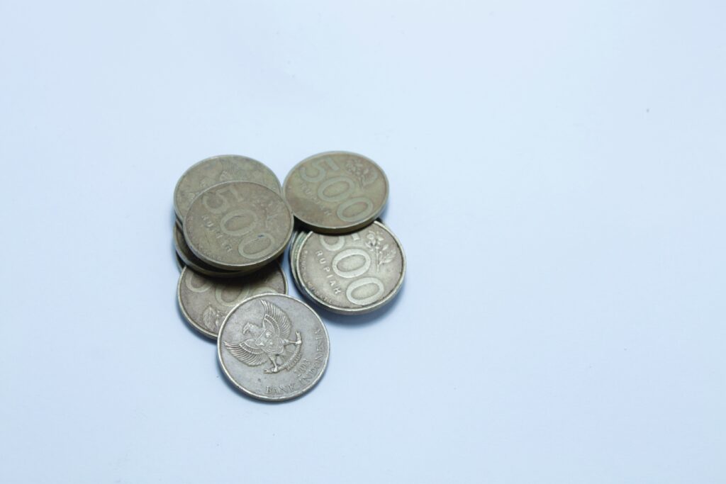 Stacked steel pennies on display with white background