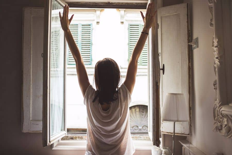 Woman opening her window