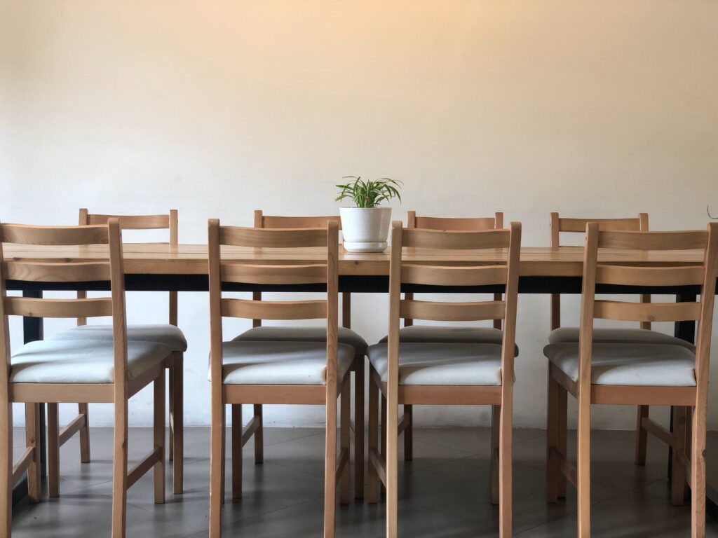 Wooden dining table with cushioned dining chairs