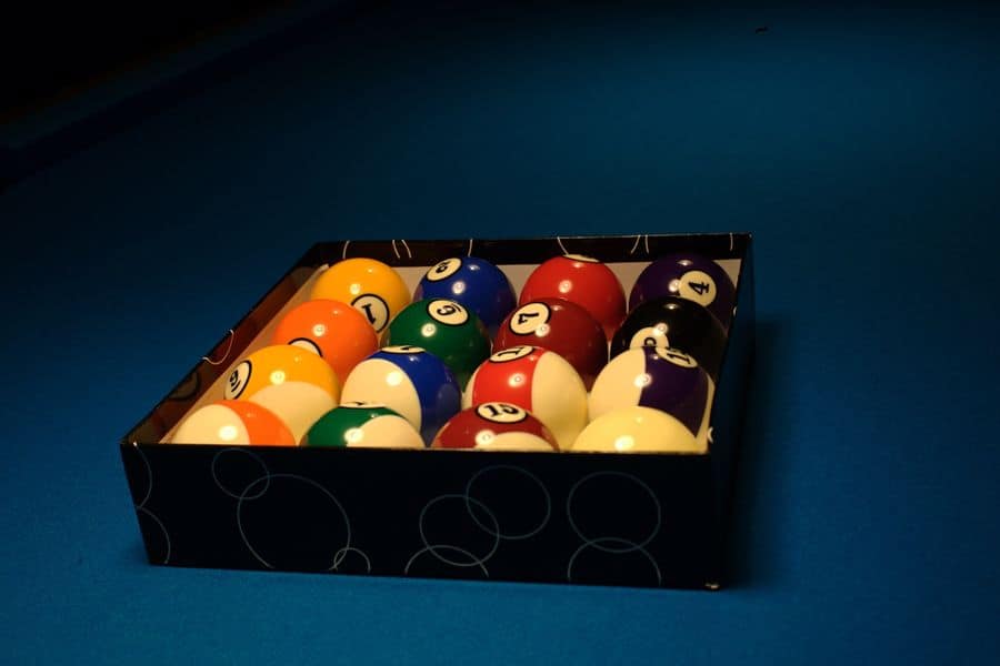 Newly cleaned billiard balls stored in a box