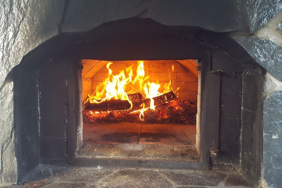 Fire lit in a brick oven