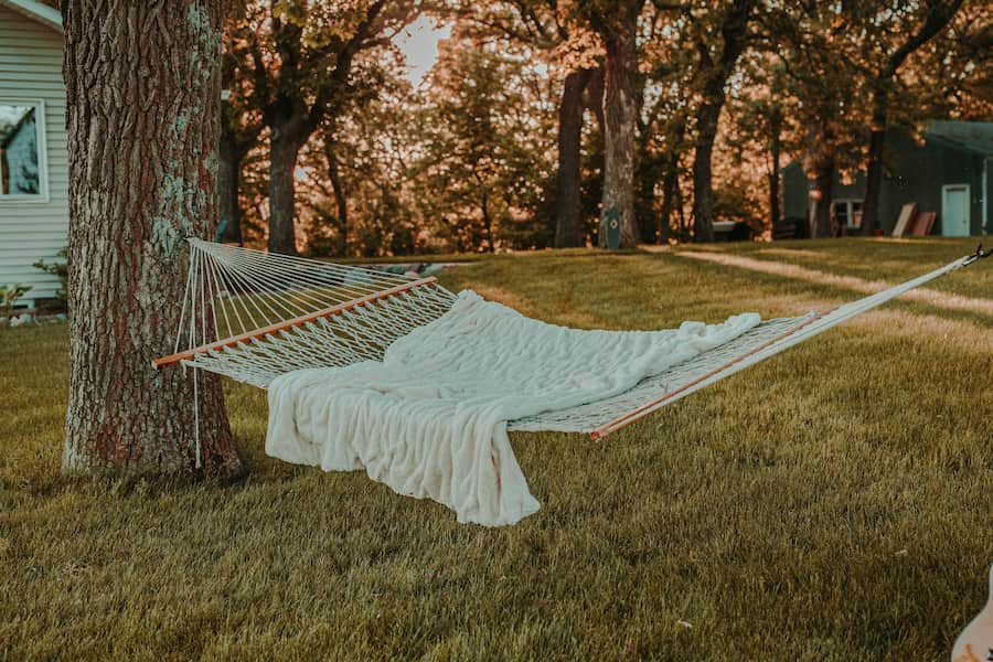 White rope hammock on a yard