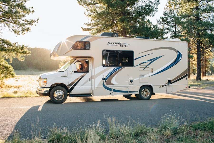 White and brown RV on road during daytime