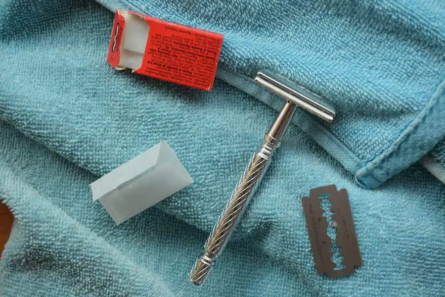 Safety razor on blue cloth