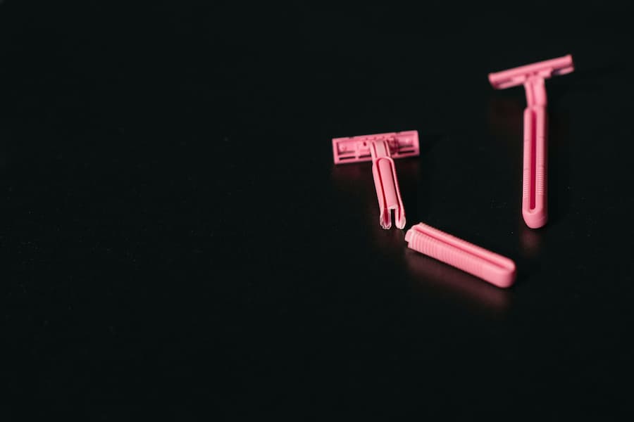 Broken safety razor in pink color