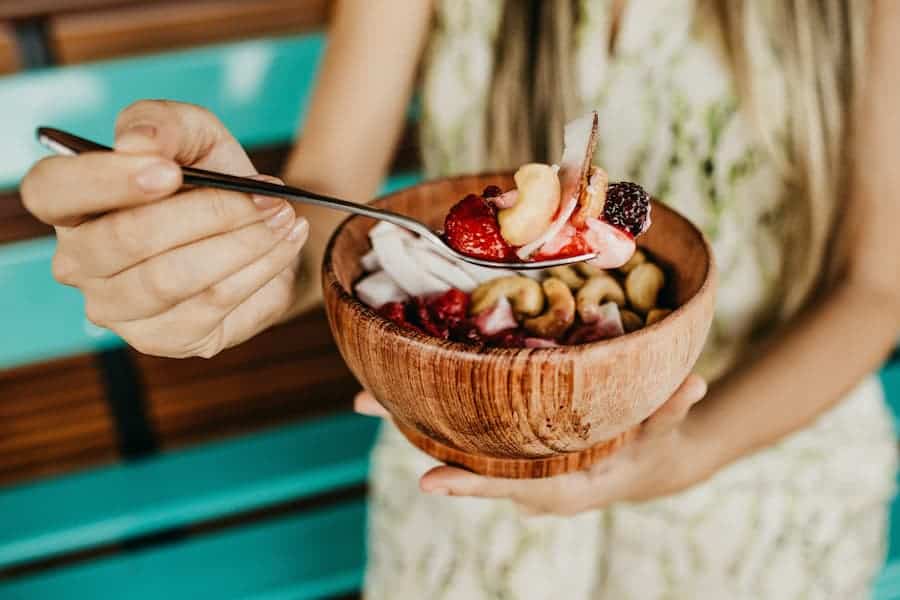 Wooden salad bowl with fruits