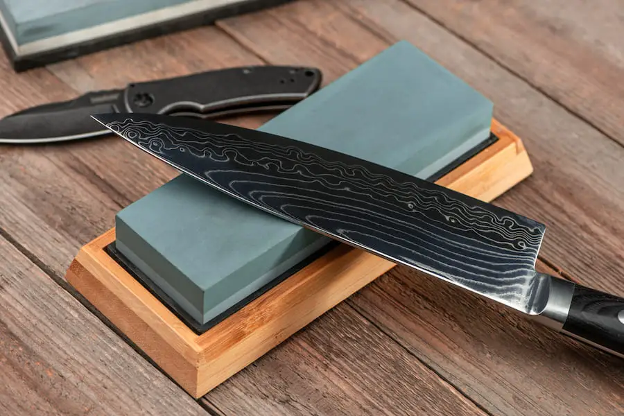 An image of a knife and a clean whetstone