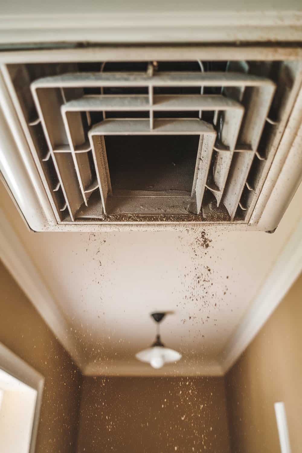 Dirty air vent with dust particles falling