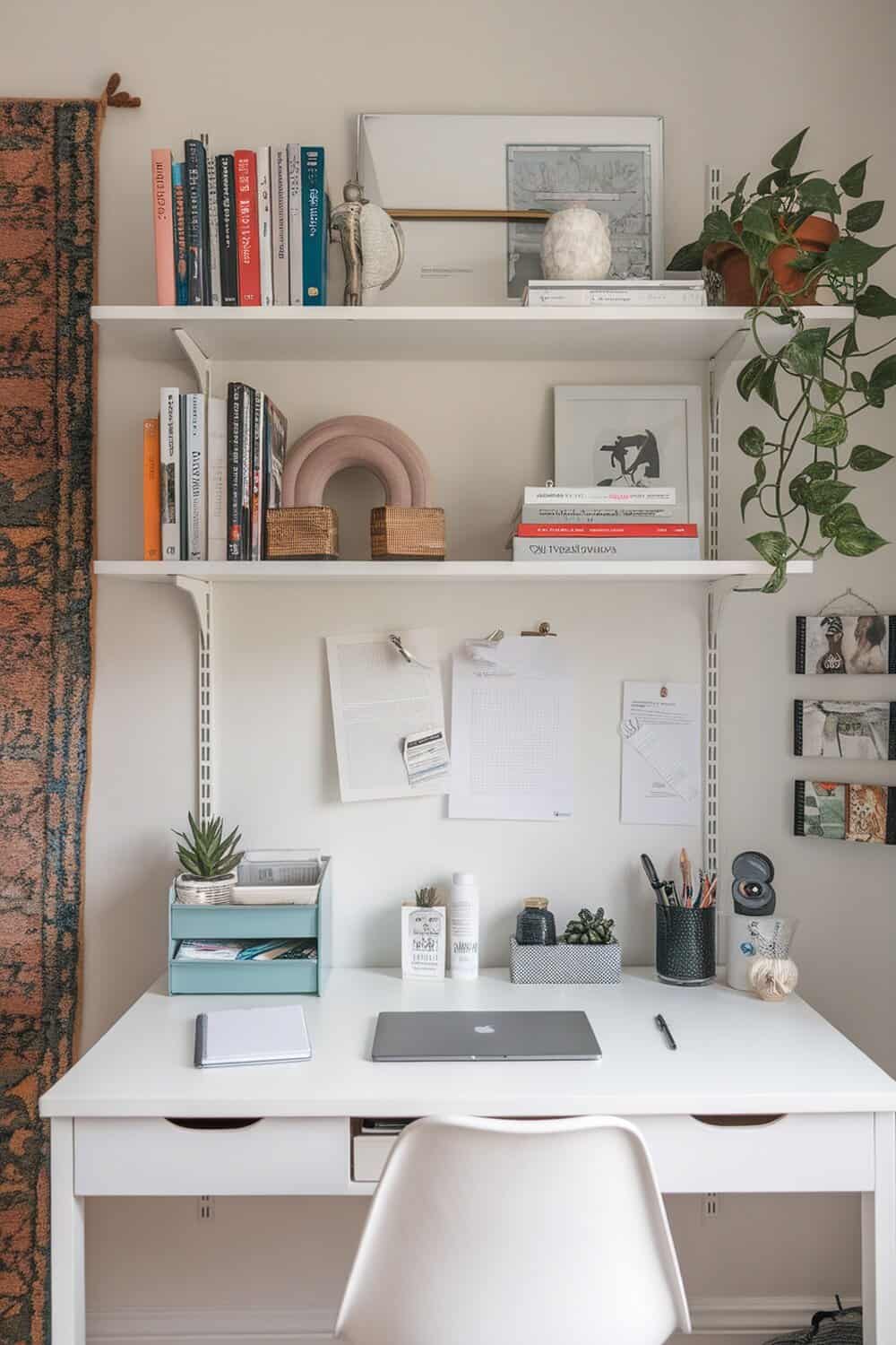 A clean and organized home office desk with books, plants, and stationery.