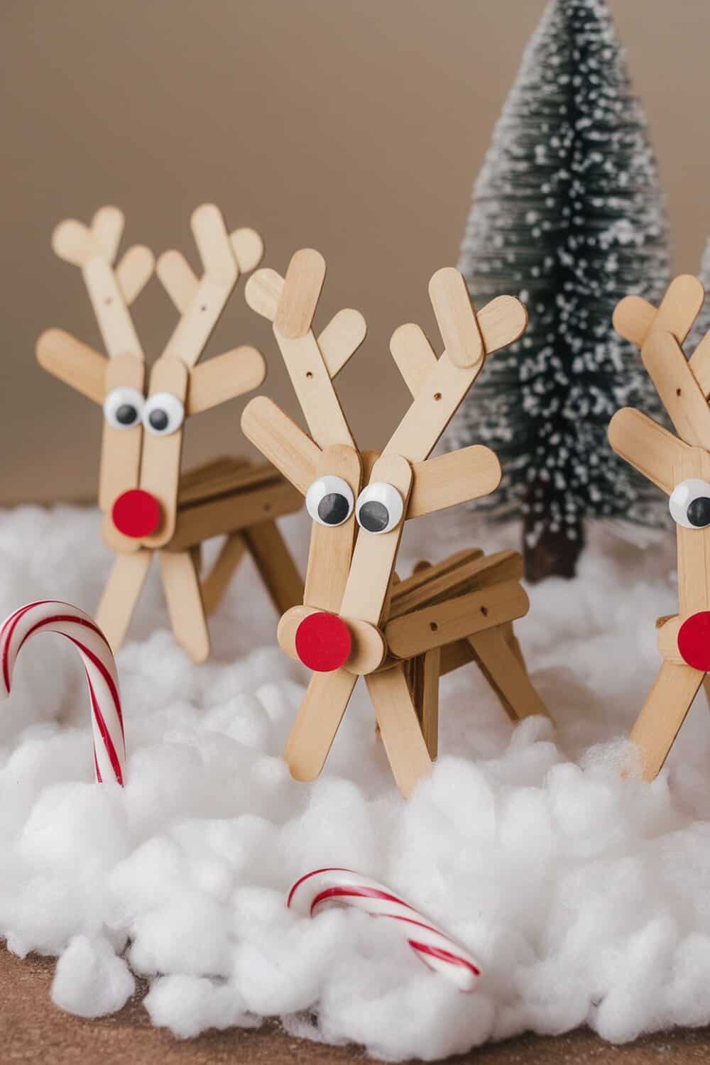 Popsicle stick reindeer decorations with googly eyes and red noses
