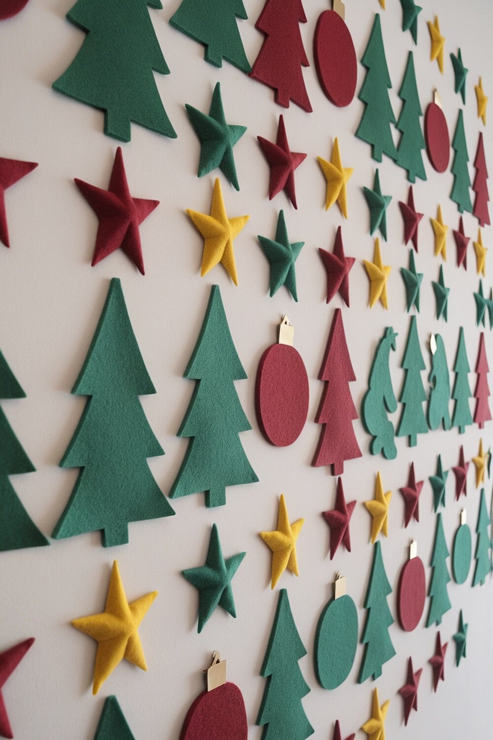 Colorful felt Christmas tree decorations including trees, stars, and ornaments.