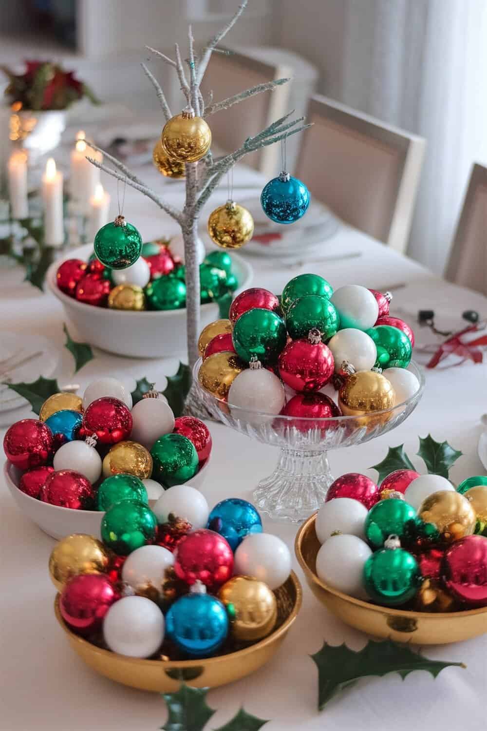 A festive display of colorful Christmas baubles in bowls and hanging from a small tree.