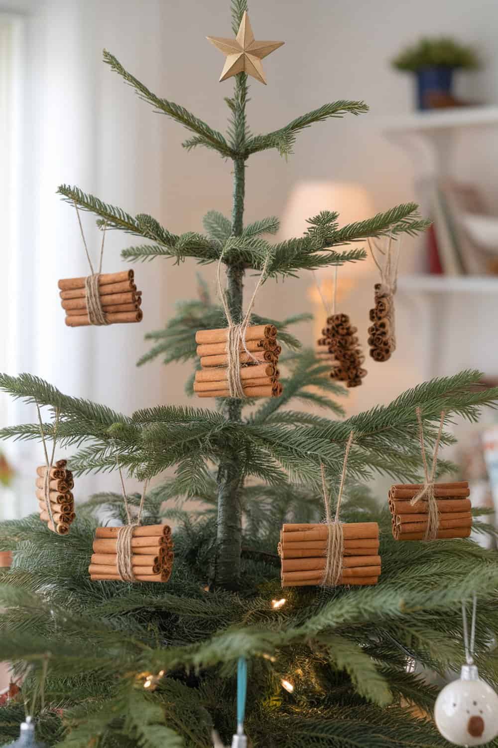 Cinnamon stick ornaments hanging on a Christmas tree