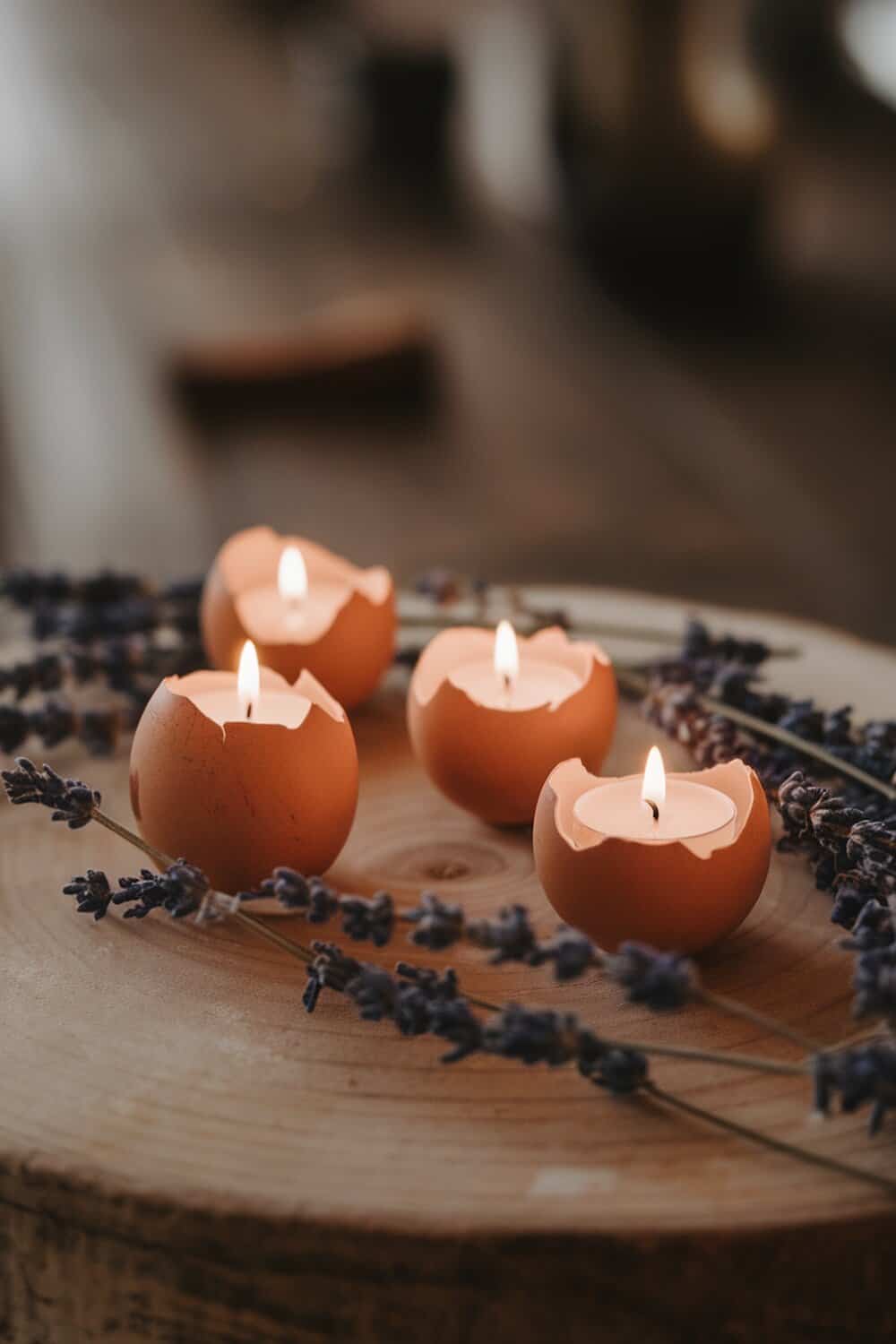 Eggshell candle holders with lavender on a wooden surface