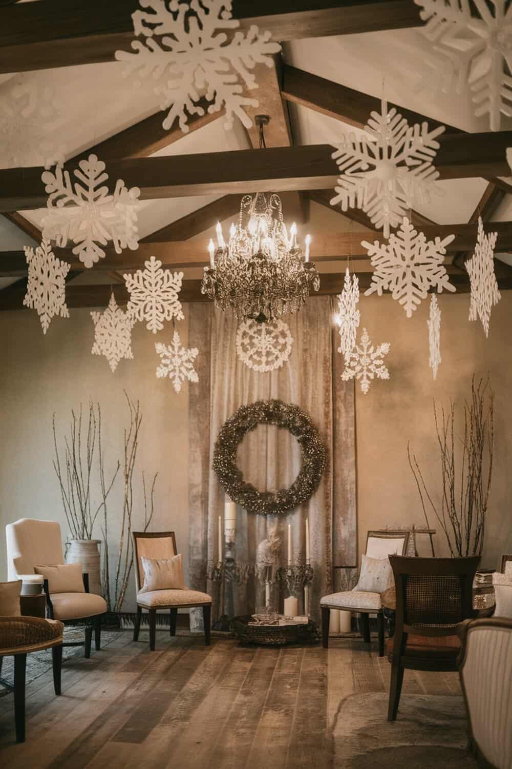 A room decorated with handmade paper snowflakes hanging from the ceiling.