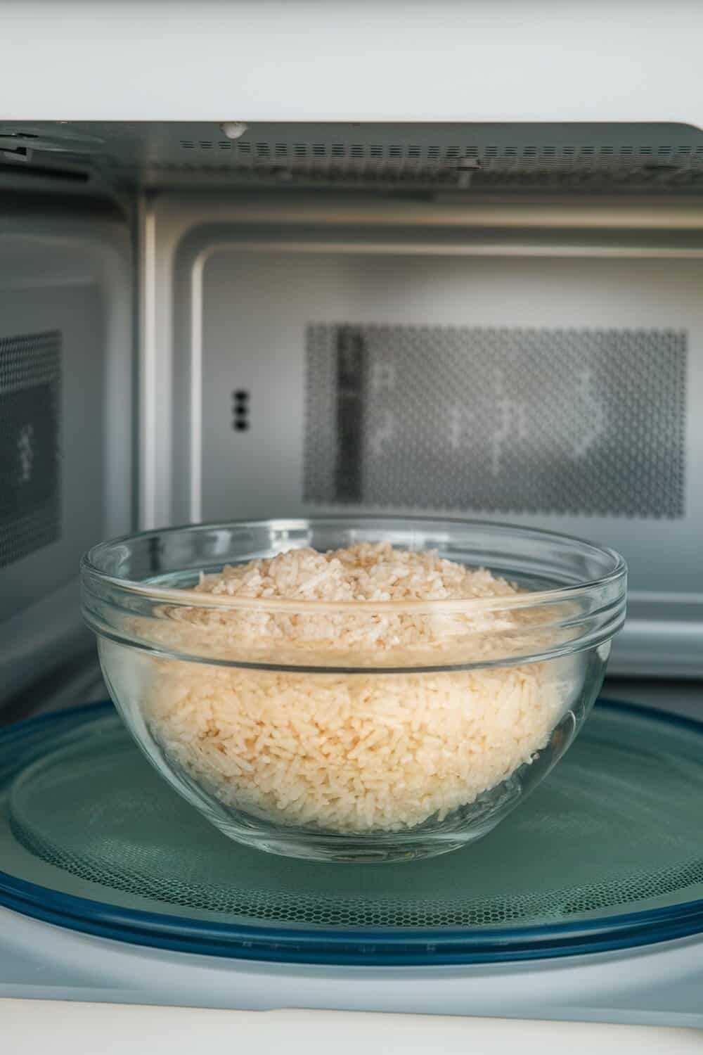 A bowl of rice in a microwave, used as an odor absorber.