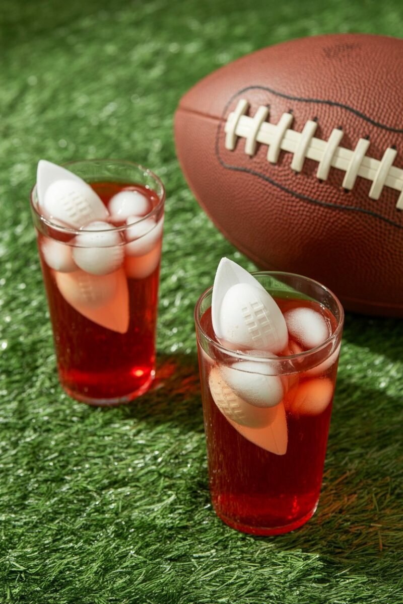 Drinks with football-shaped ice cubes at a football party