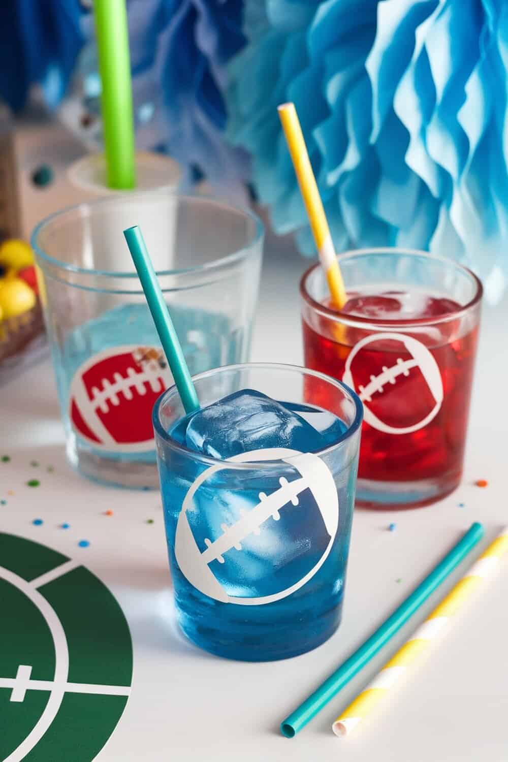 Colorful drinks with football-themed ice cubes and straws.