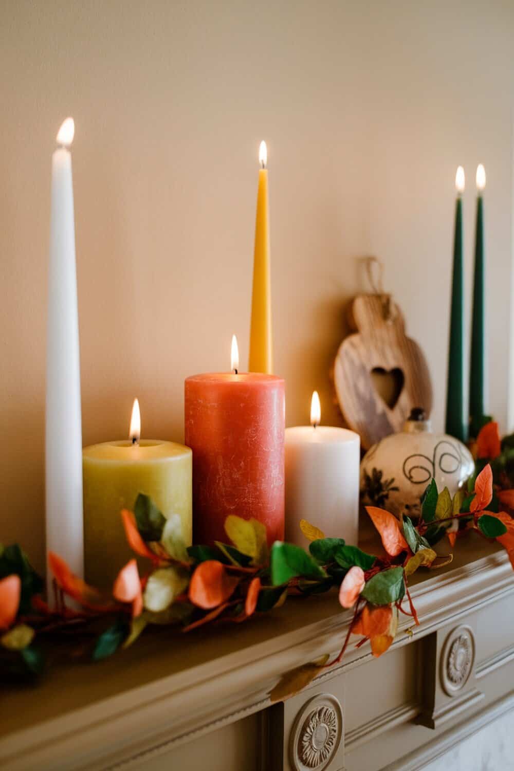 Colorful candles and decorative accents on a mantel.