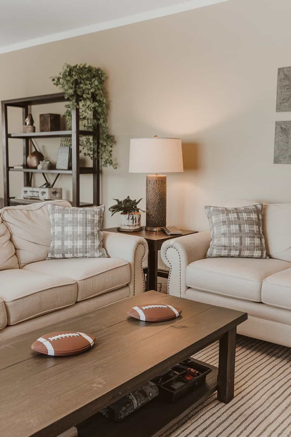 A cozy living room with football-themed coasters on a coffee table.