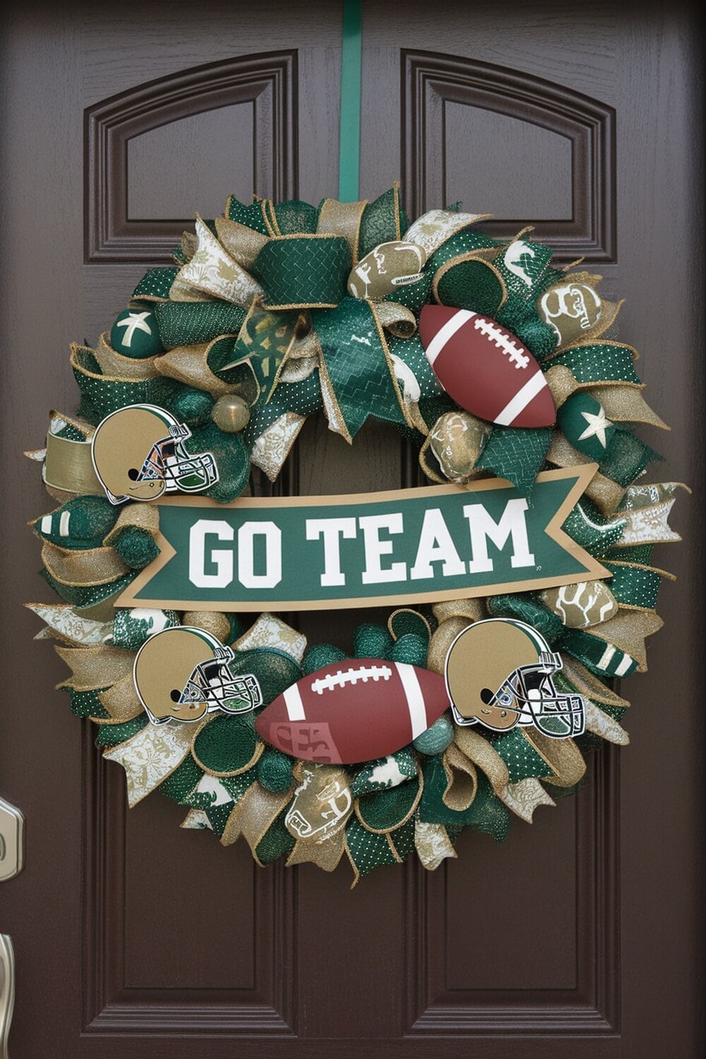 A decorative wreath featuring footballs, team helmets, and a banner that says 'GO TEAM' in vibrant colors.